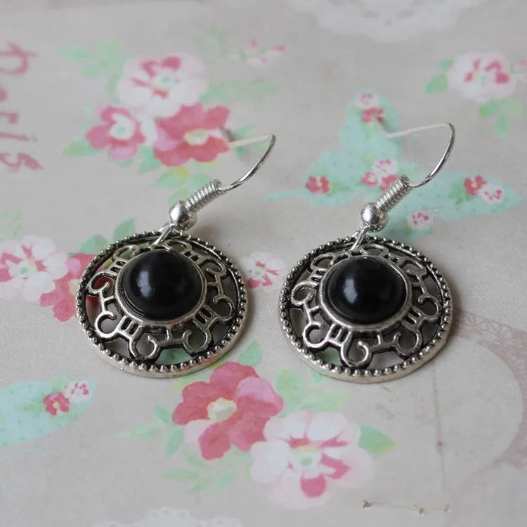 Handmade Miao silver retro earrings with turquoise inlay and geometric flower disk design