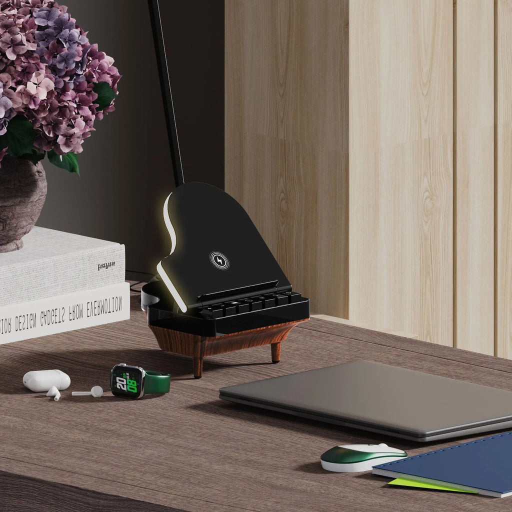 Black 3-in-1 Bluetooth speaker with wireless charger and phone holder on a desk
