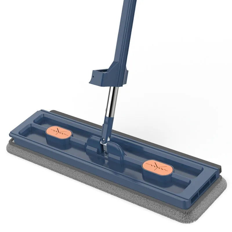 Large blue flat mop with long stainless steel handle and rotating head shown on hard floor