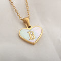 Personalised white shell heart necklace with gold chain and initial letter engraving