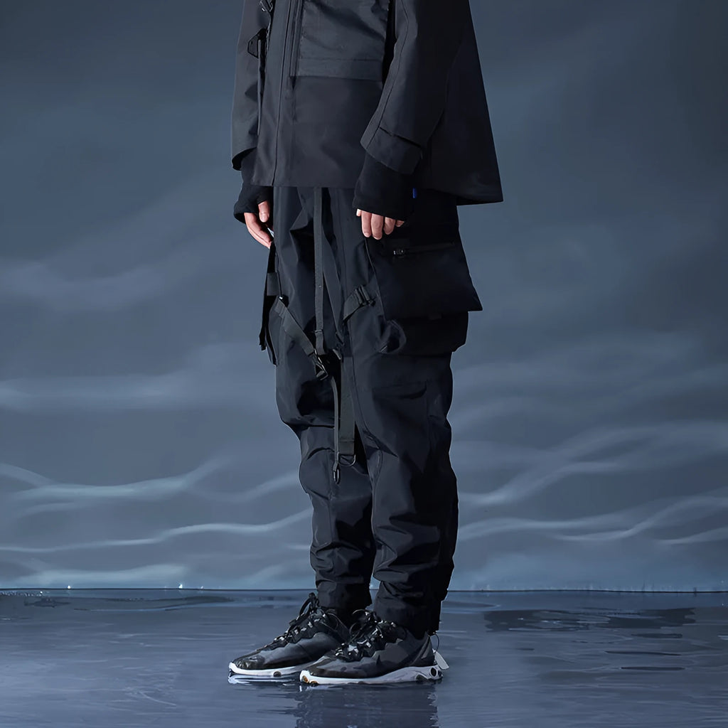 Black waterproof paratrooper trousers with integrated pant straps and 100% polyester fibre construction