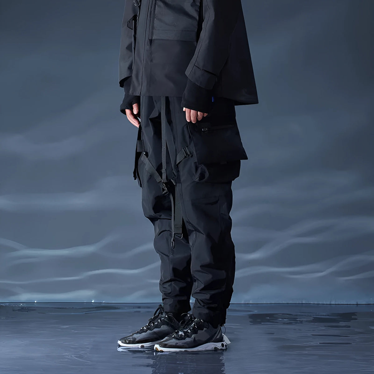 Black waterproof paratrooper trousers with integrated pant straps and 100% polyester fibre construction