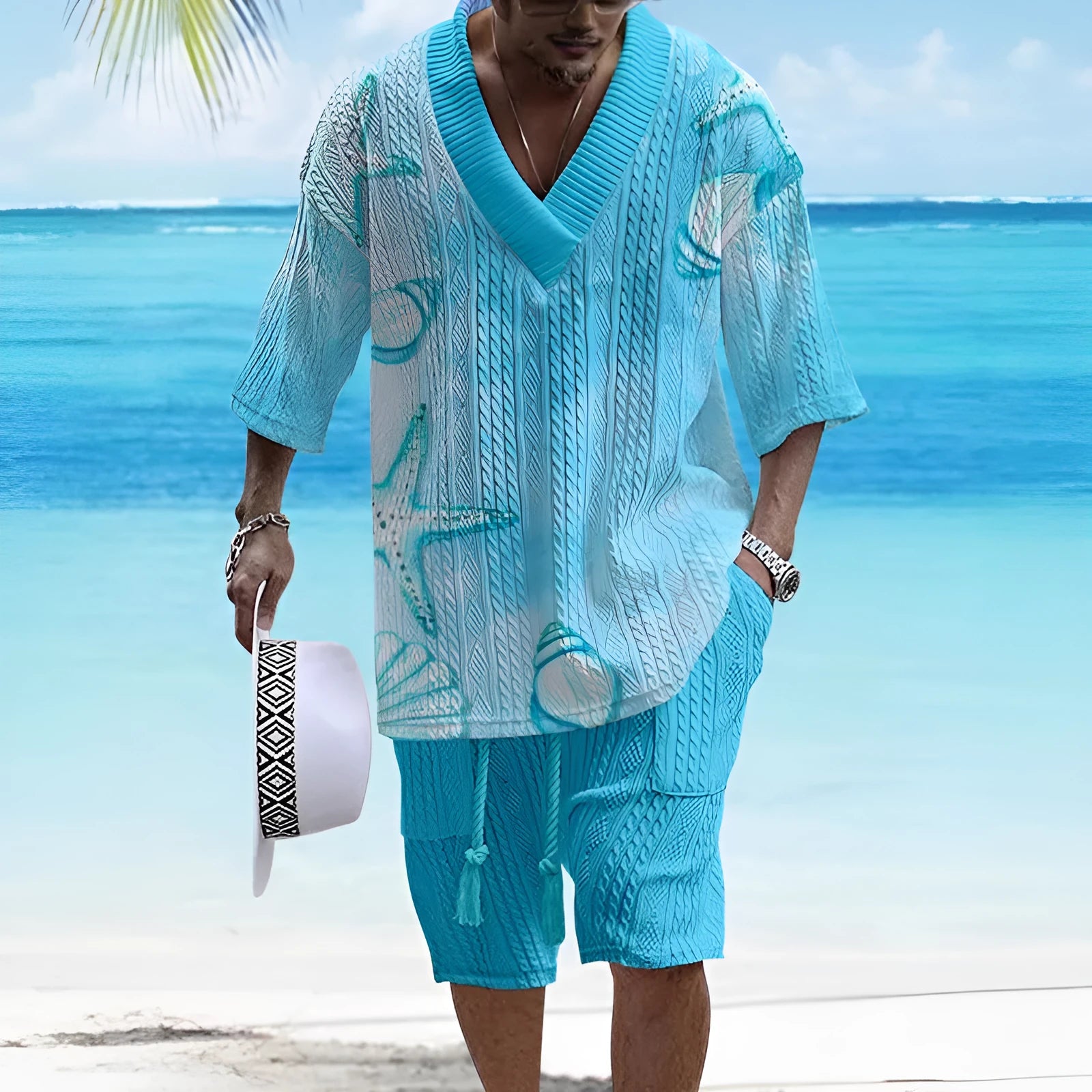Man wearing a loose blue short sleeve casual suit top and matching shorts from the BMZJTZ colour range.