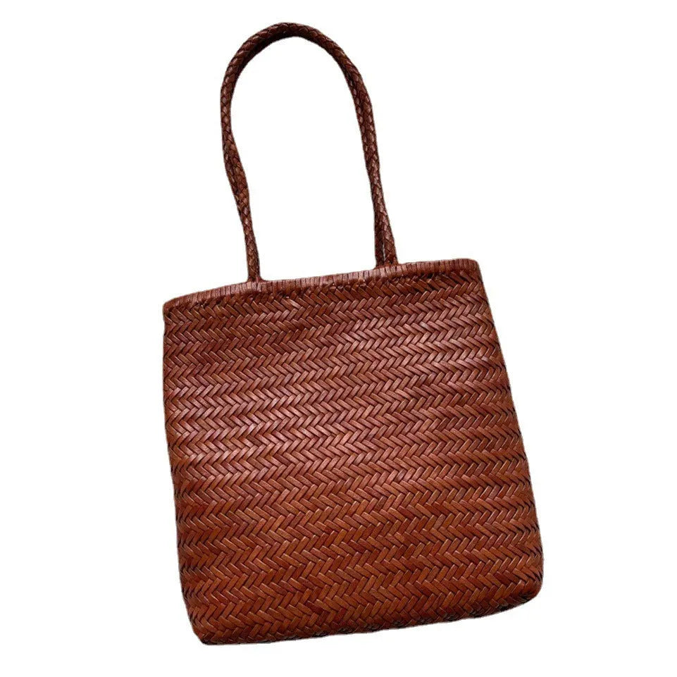 Handmade woven brown leather tote bag with three-dimensional pockets and vintage finish