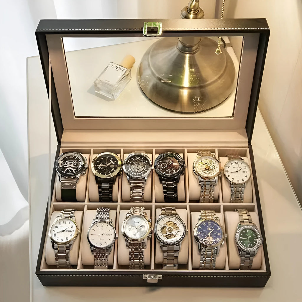 Grey leather watch storage box with see-through lid showing organised watch storage compartments