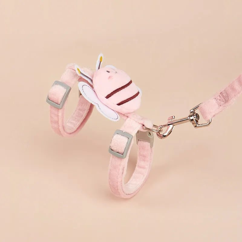 Pink bee-shaped adjustable cat tether rope with strap for outdoor use.