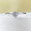 Minimalist silver crown-shaped ring with linear design, shown in electroplated gold and platinum finishes.