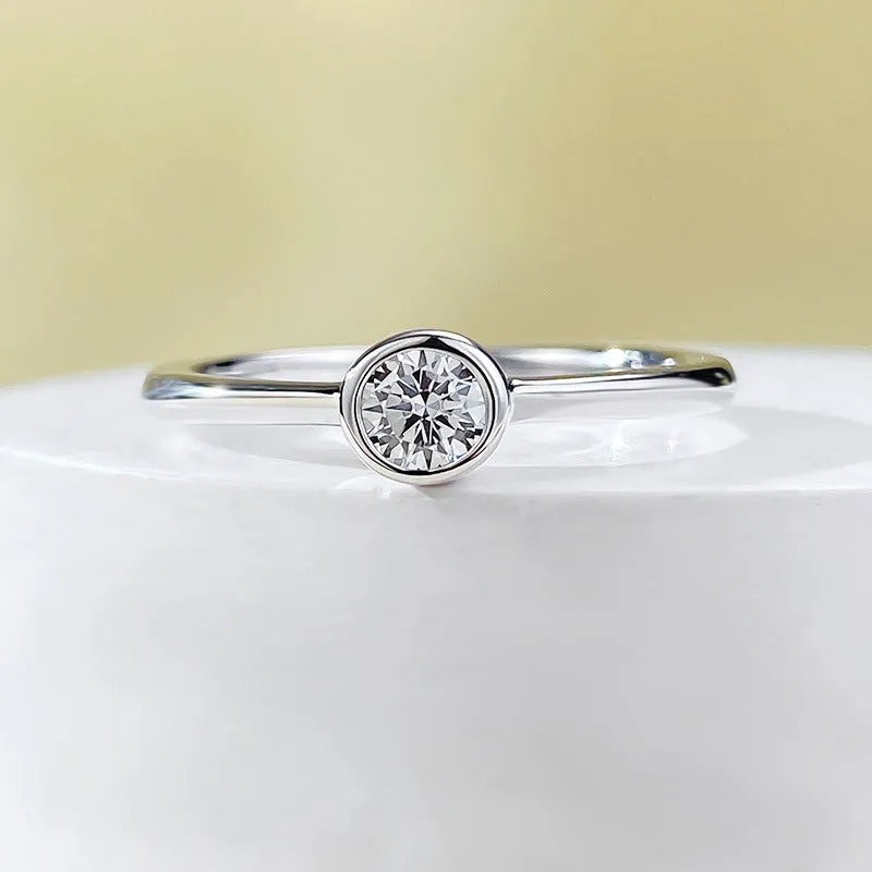 Minimalist silver crown-shaped ring with linear design, shown in electroplated gold and platinum finishes.