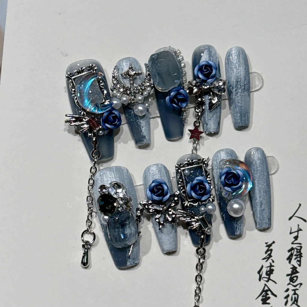 False nails with rose floral patterns in night blue colour, size options displayed