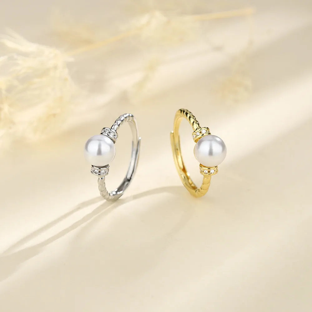 Geometric twist pearl ring with adjustable copper construction in gold colour
