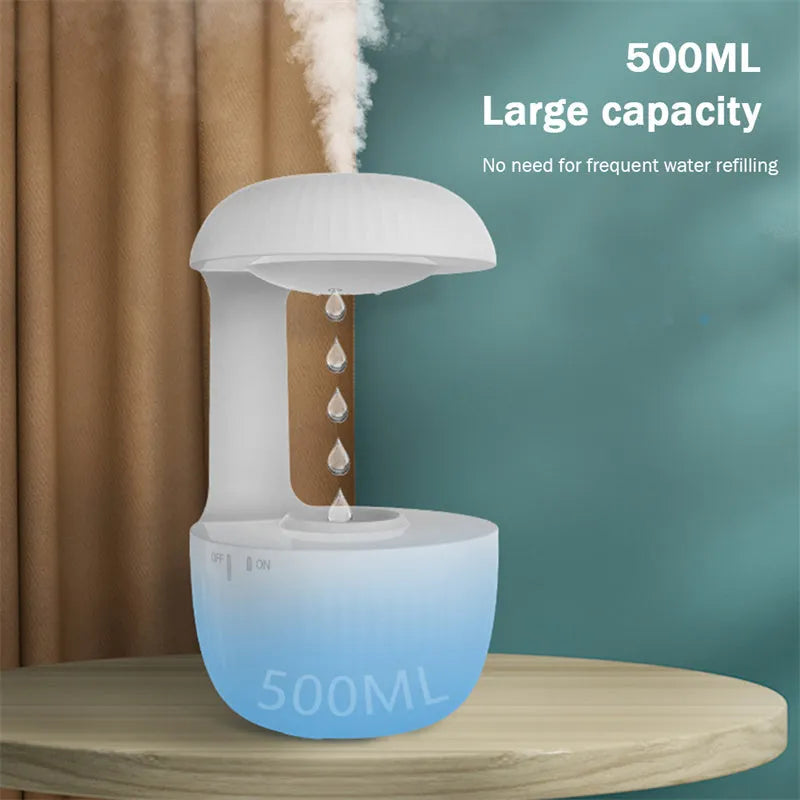 White anti-gravity air humidifier with levitating water drops and USB cable on a desk