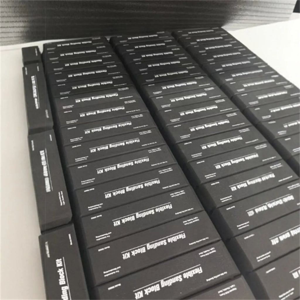 Set of seven black metal EVA frosted building blocks arranged together