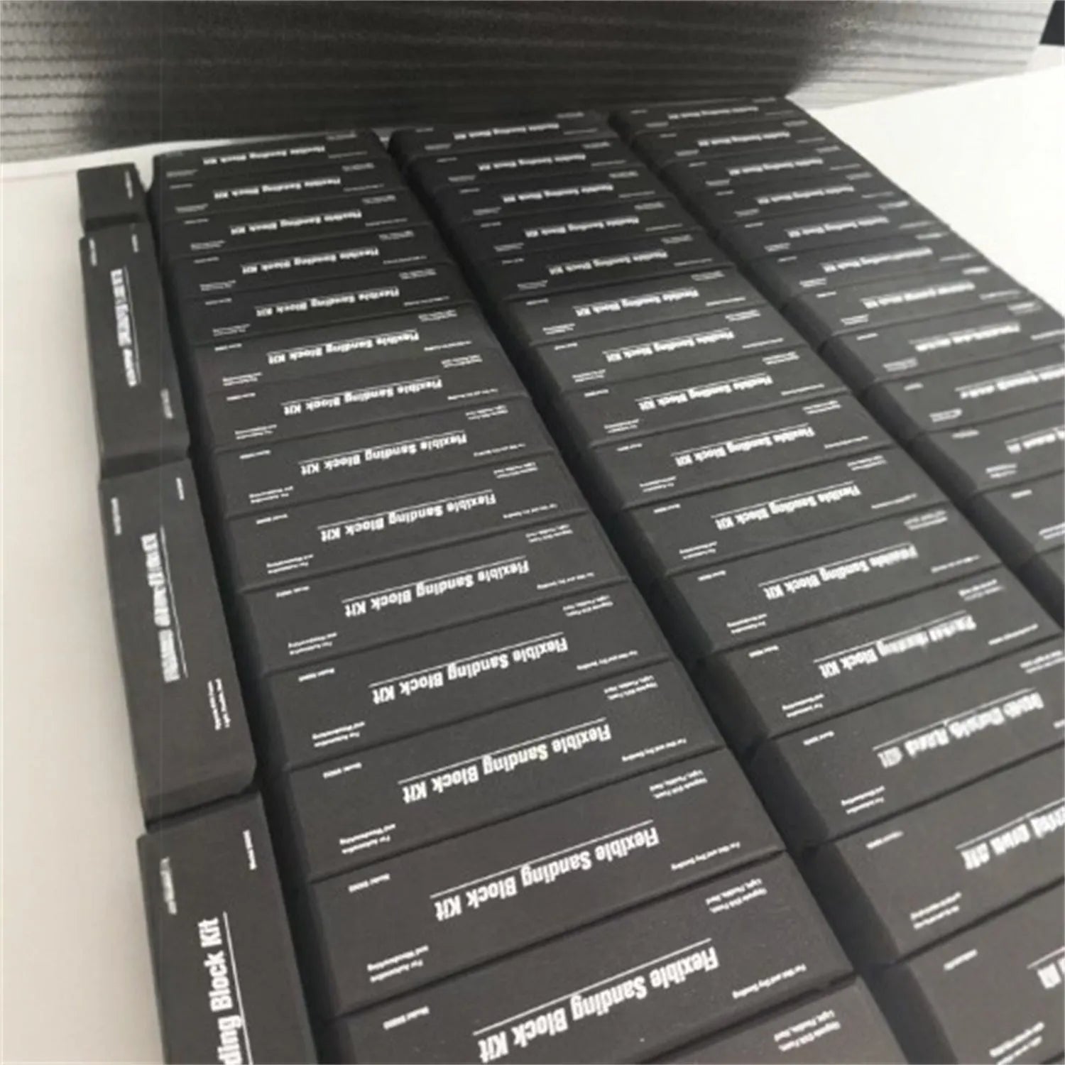 Set of seven black metal EVA frosted building blocks arranged together