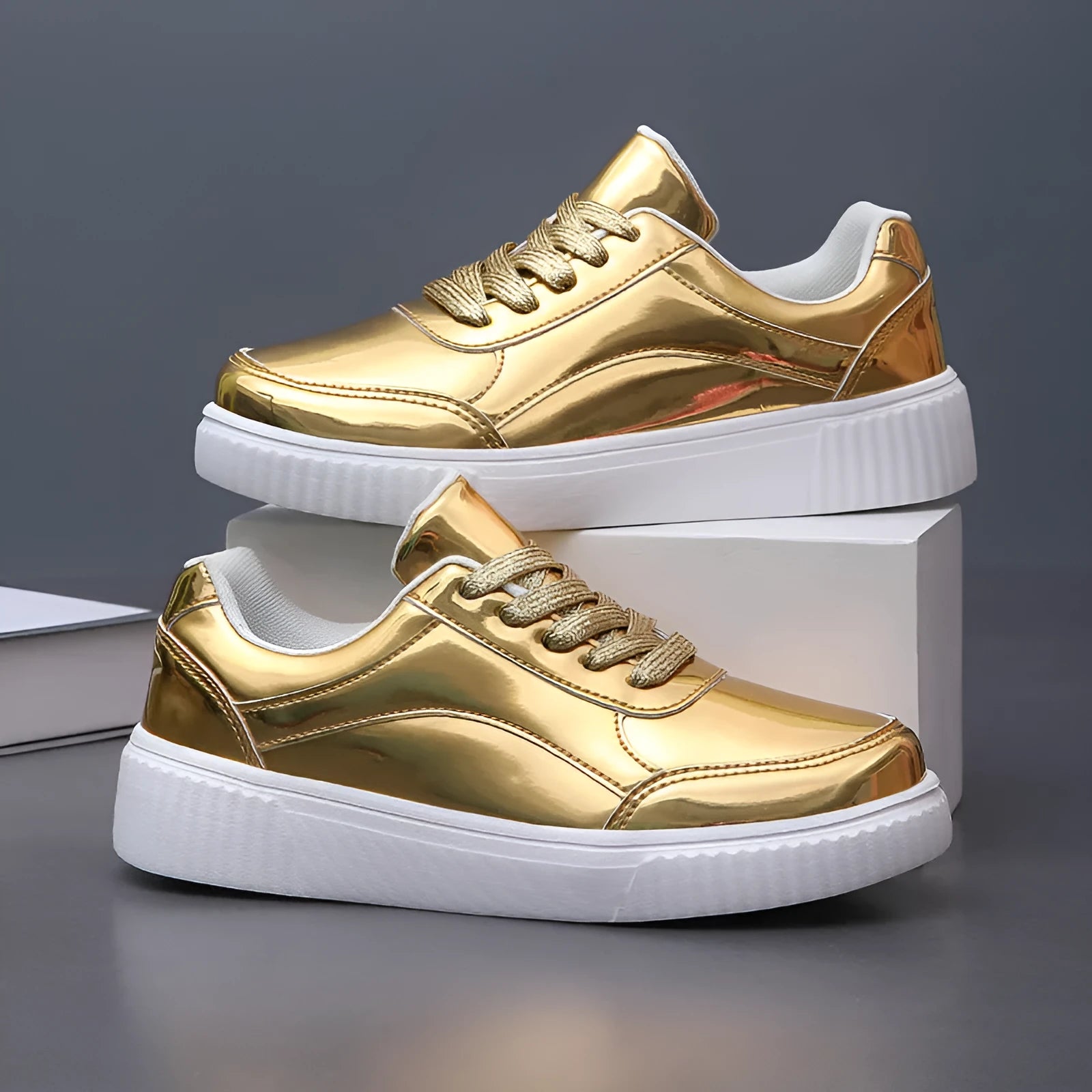 Rose gold sequinned platform sneakers with round toe and thick MD sole on a white background