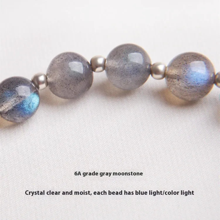Grey moonlight crystal bracelet with Zodiac design, featuring 7.5mm moonlight lime and strawberry quartz stones on 925 silver.