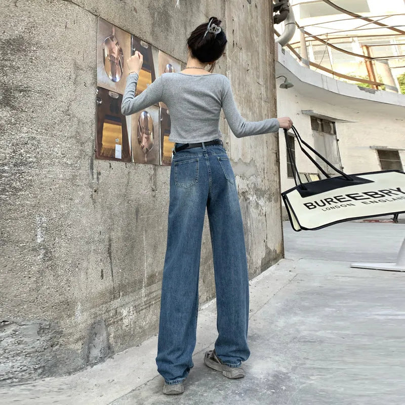 Women's retro blue straight leg jeans with a high waist, shown on a hanger.