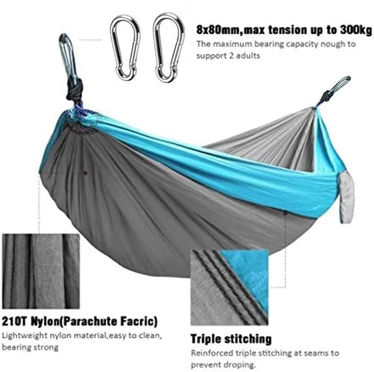 Blue parachute cloth camping hammock hung between trees showing 270cm length