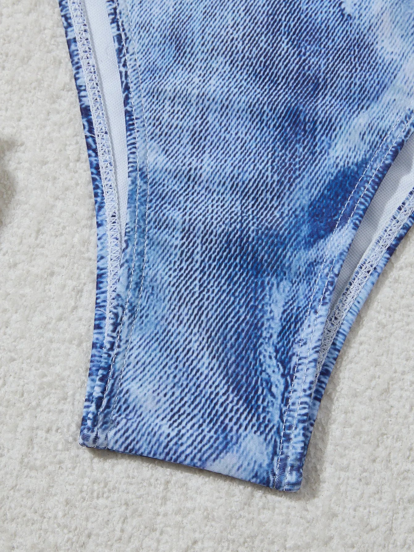 Women's denim blue printed bikini set with strap design, showing front and back views