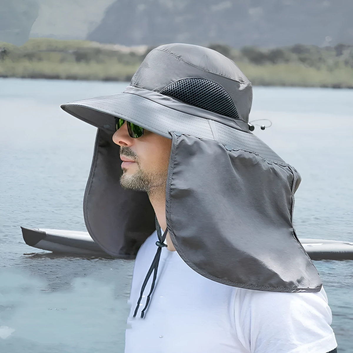 Summer fisherman hat with neck protection in khaki, showing dome crown and nylon fabric outdoors