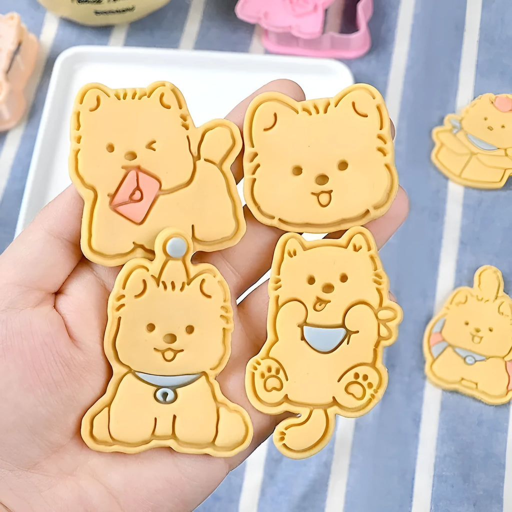 Three dimensional plastic press mould for creating puppy cartoon biscuits and cake decorations.