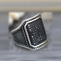 Black alloy ring with copper-inlaid zircon detail showing European and American jewellery style