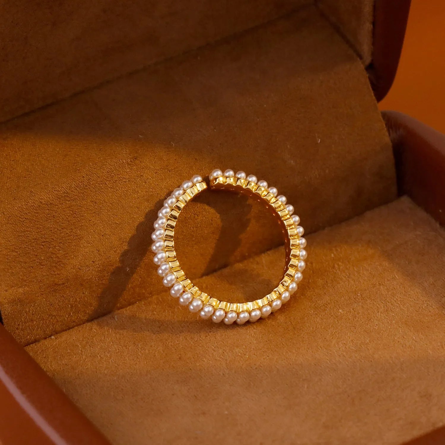 Gold geometric women's ring with a round pearl and open mouth adjustable design.