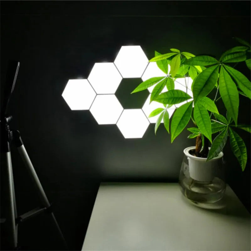 British Creative Helios touch wall lamp with hexagonal modular assembly and plastic shade, 103 by 90 by 30 mm