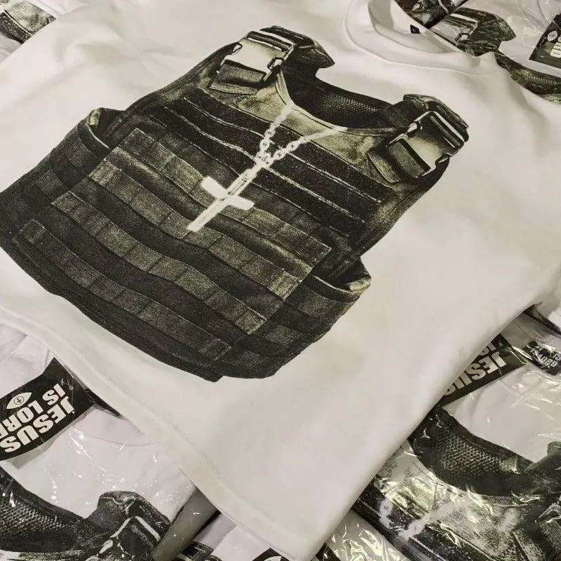 Man wearing a printed retro style cotton t-shirt with drop shoulder sleeves in a graphic design.