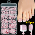 Box of 120 short square false toenails with French white tip design on nude base.