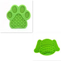 Silicone dog lick pad in red, blue or green, 22 x 14.5 x 0.8 cm, food-grade textured mat for slow feeding and bath distraction.