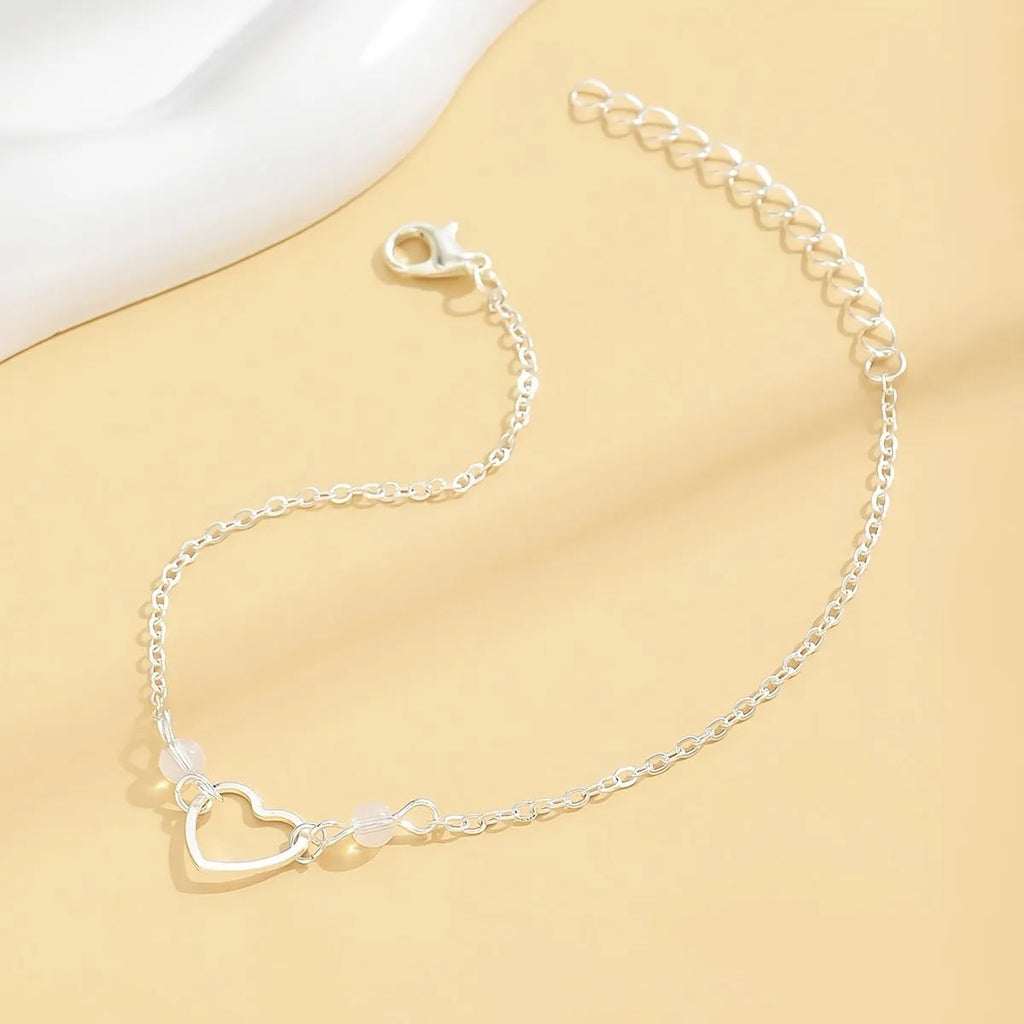 Women's adjustable anklet with geometric heart pendant in gold or silver tone