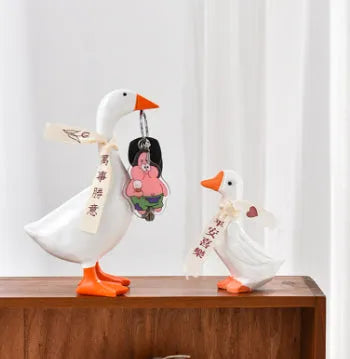 White simulated duck magnetic resin ornament on a fridge door