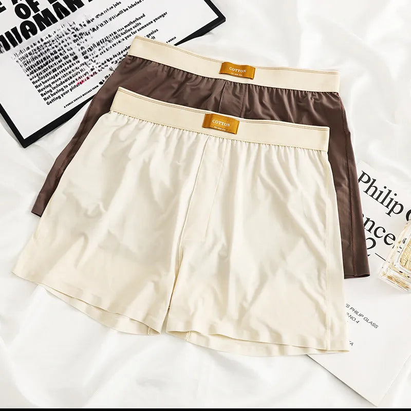Men's solid colour ice silk loose fit boxer shorts on a white background.