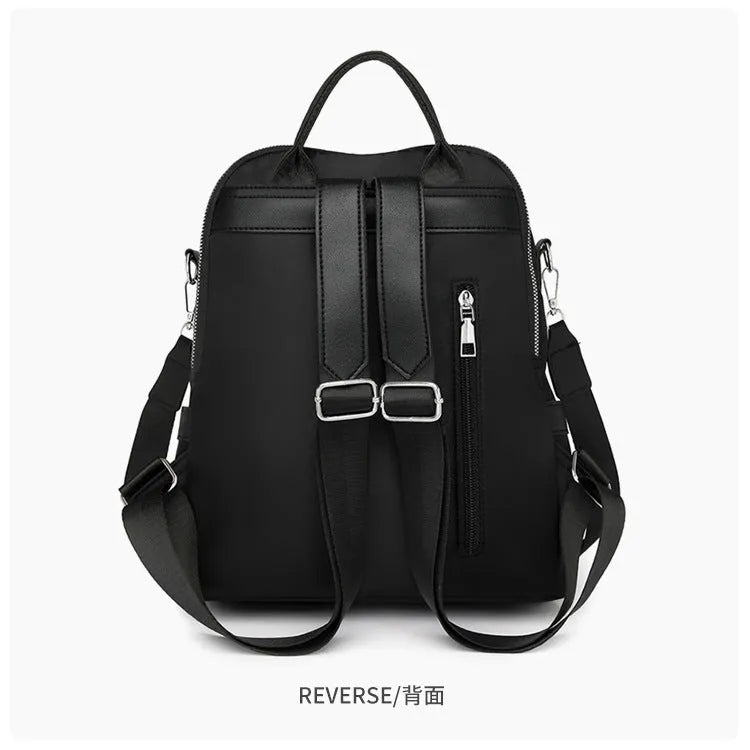 Soft black PU backpack with large main compartment and front organisational pockets