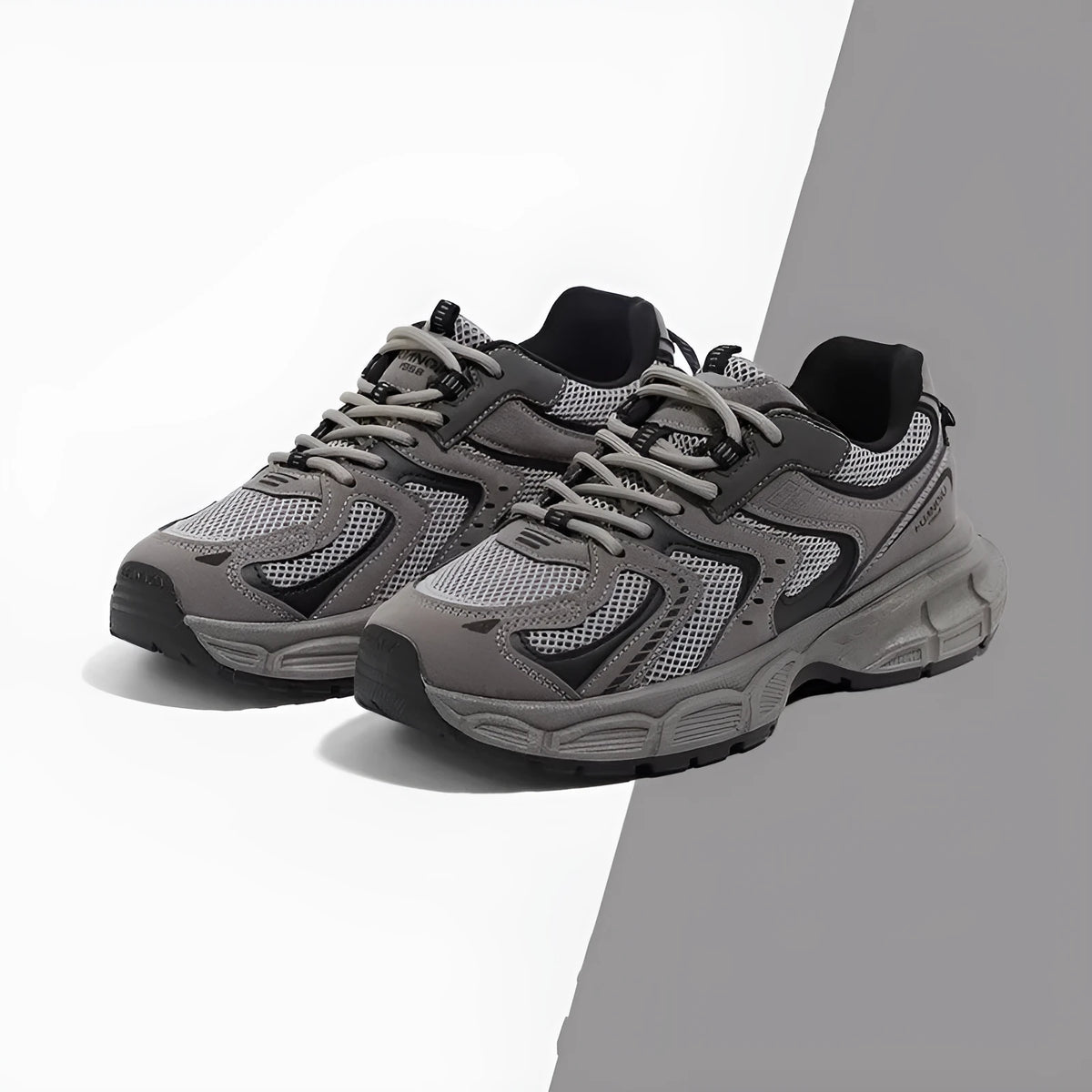 Grey low-top casual sneaker with PU mesh upper, round toe, lace-up front, and a flat EVA sole on a neutral background.