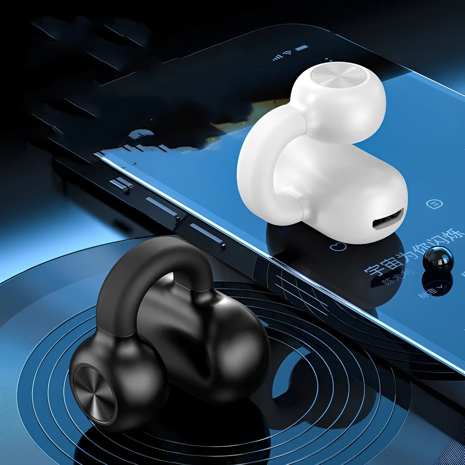 Black wireless clip-on bone conduction Bluetooth earphones shown with charging cable.