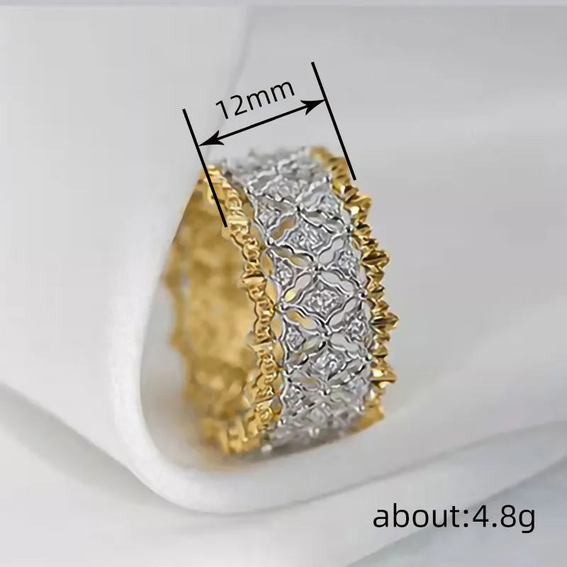 Geometric two-tone copper ring with a round zircon stone on a finger.