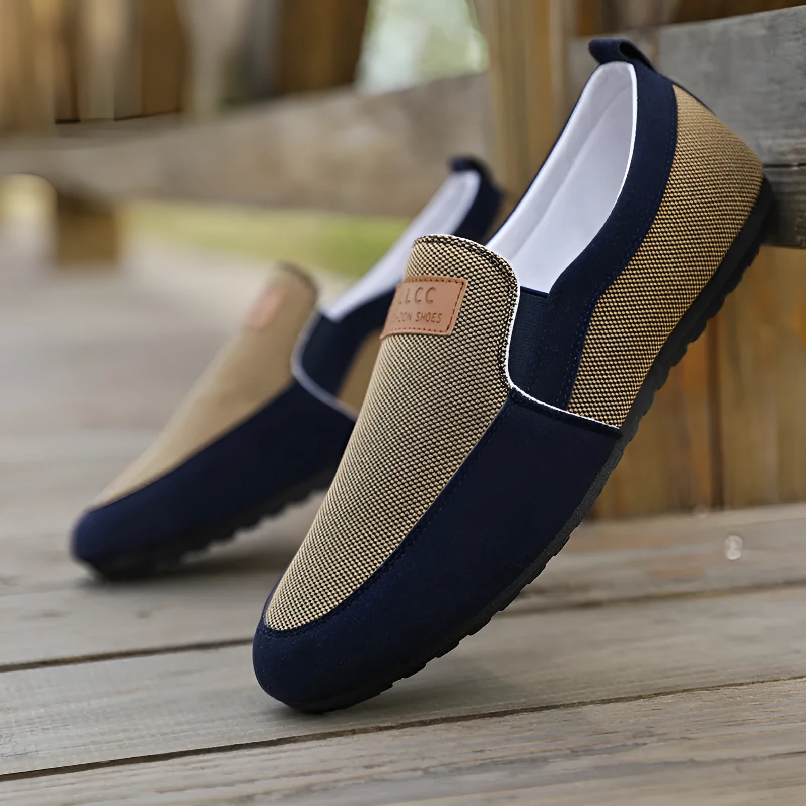 Men's grey canvas lace-up board shoes with round toe and rubber sole on a white background.
