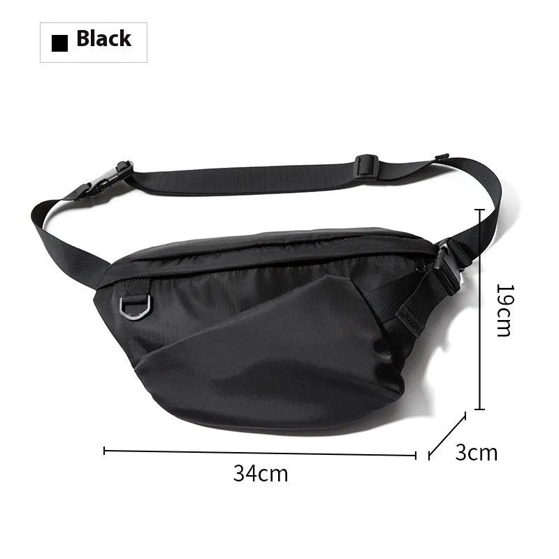 Black slanted chest bag with sewing line details, worn crossbody style