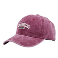 Retro-style adjustable acrylic peaked cap with embroidered letters, shown in a distressed beige colour.