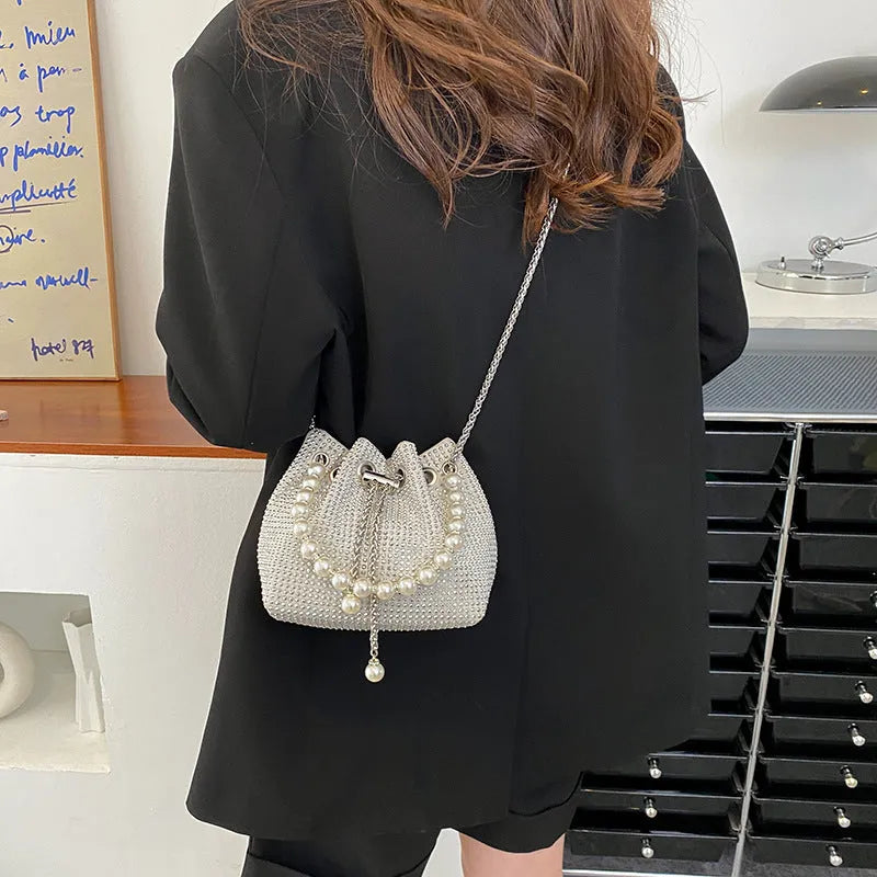PU leather crossbody bag with diamond accents, chain strap, and bucket shape in colour option