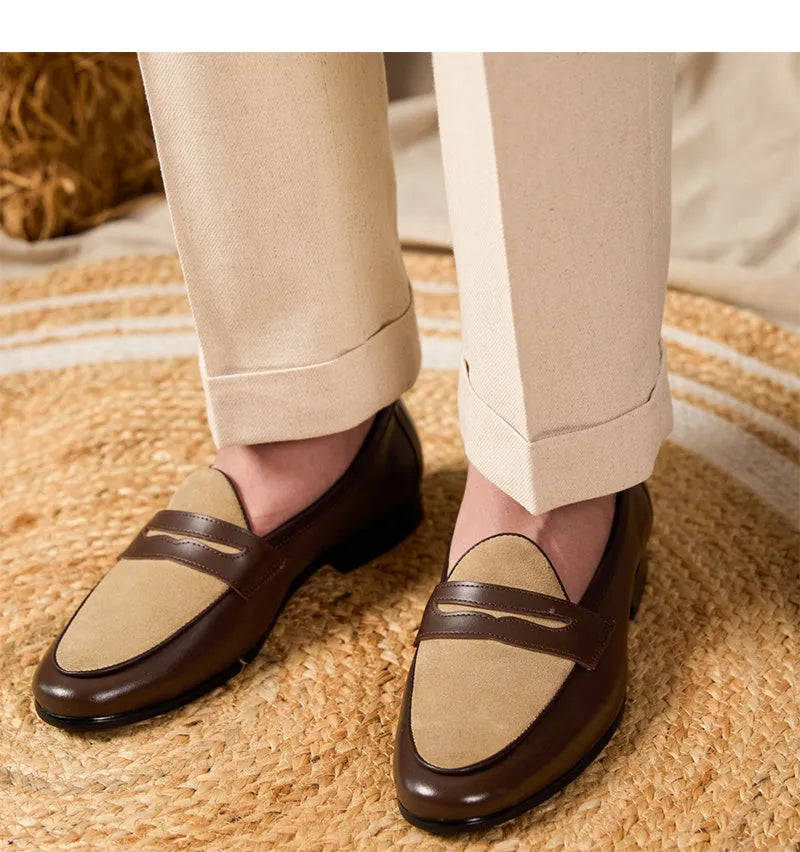 Coffee grey suede leather loafers with an elastic kick tab closure and a rubber sole.