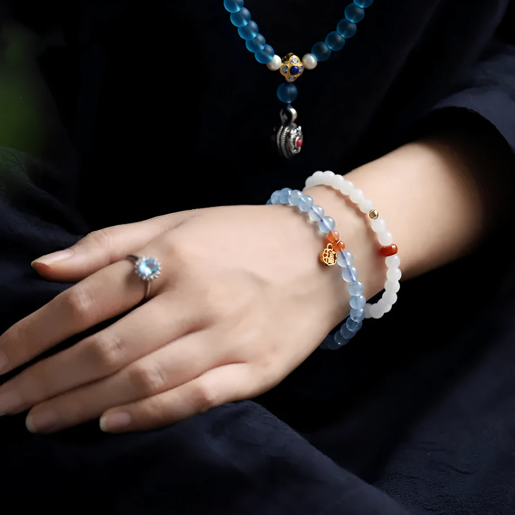 Ice translucent aquamarine bracelet with 8mm round beads and silver sequin accents