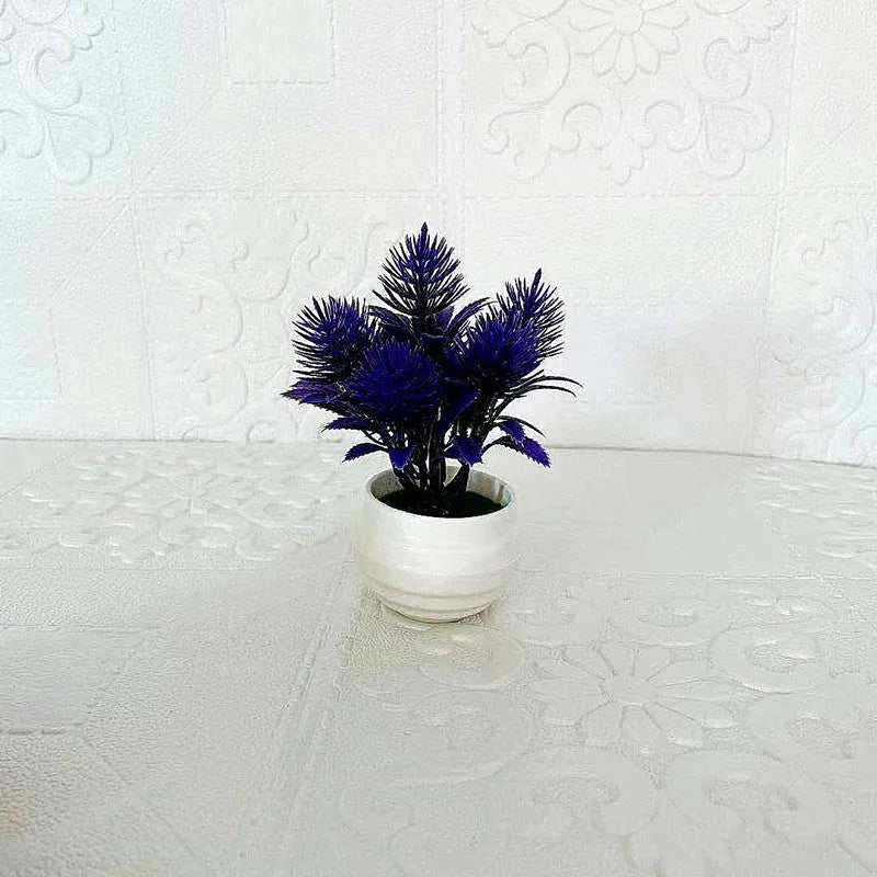 Simulated bonsai potting ornament in green plastic with bonsai shape on white background