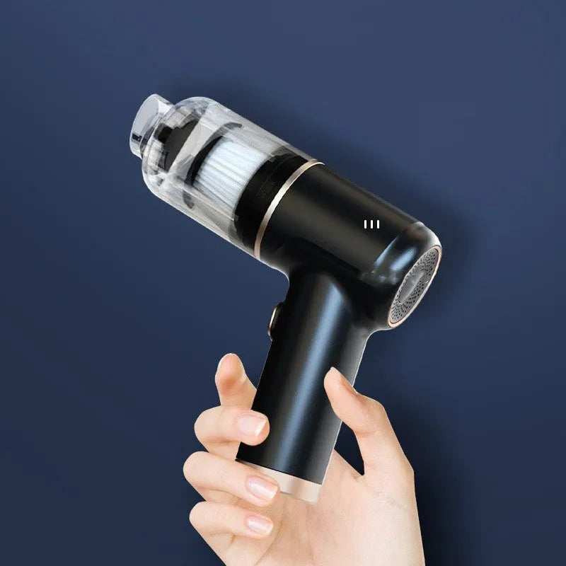 Black cordless handheld car vacuum cleaner with attachments including brush head and inflation nozzles.