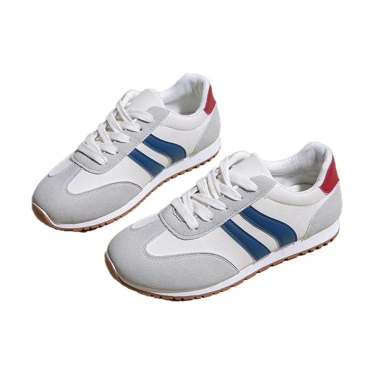 Blue and grey leisure sports shoes with Cortez stripes pattern, flat rubber sole, and round toe design