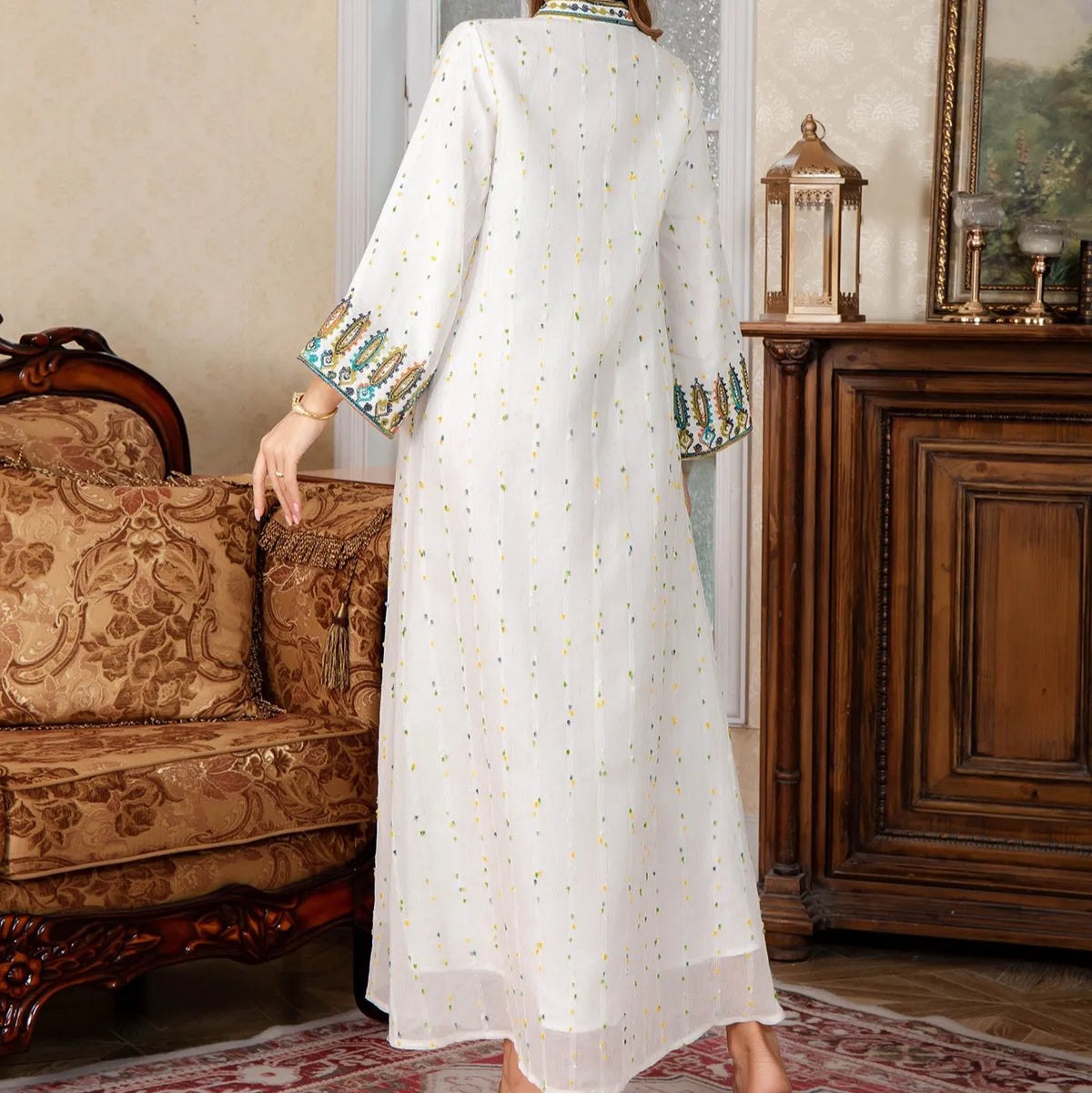 White polyester Arabic robe for women with long sleeves and long skirt.