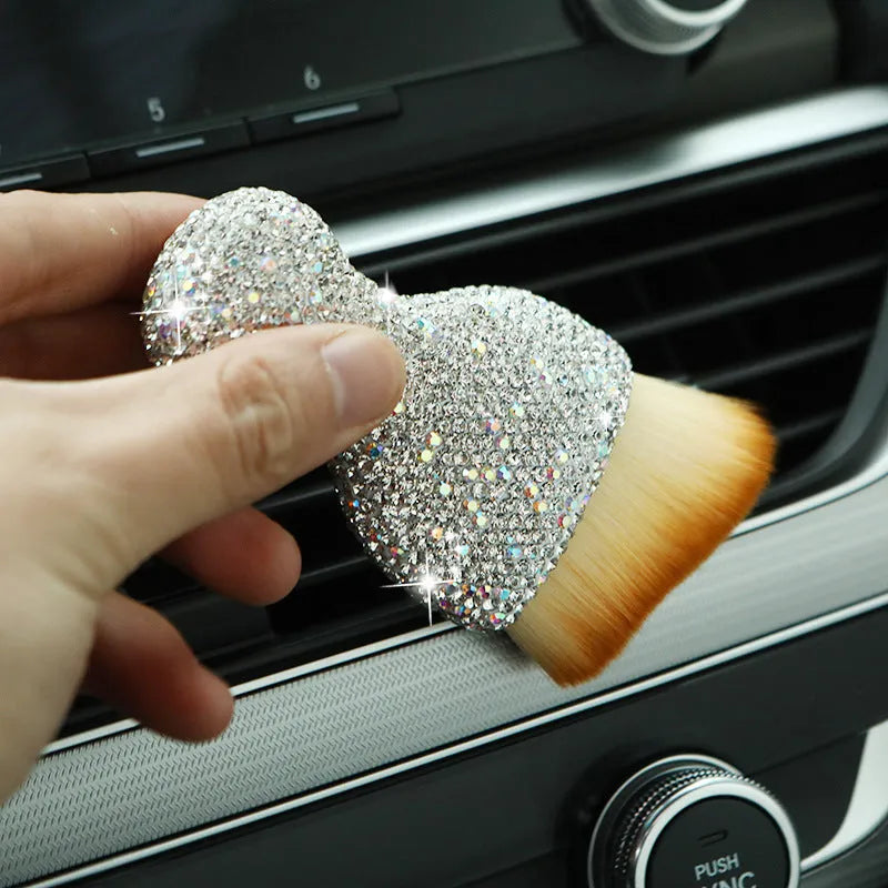 Compact white PVC car interior cleaning brush for dusting dashboard and vents.