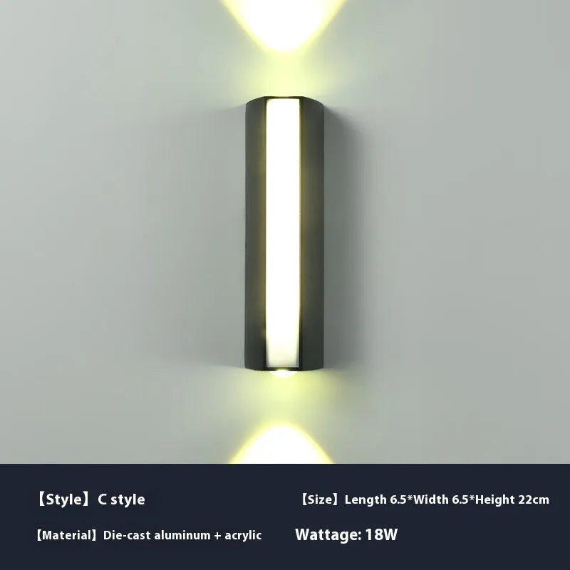 Simple modern outdoor waterproof LED wall lamp in black aluminium with glass panel for garden or patio