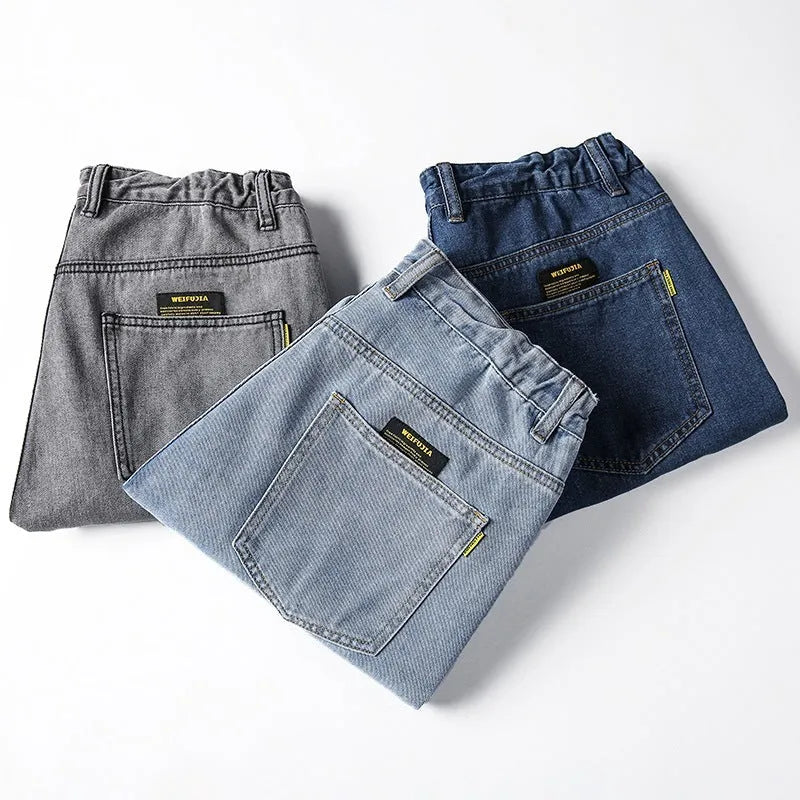 Men's loose straight casual jeans in dark blue cotton with mid waist and zipper fly